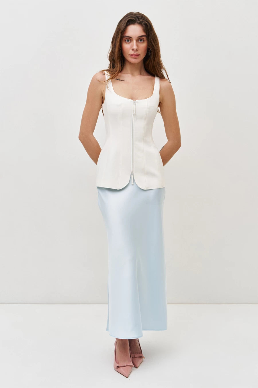 Cream corset top with a zip