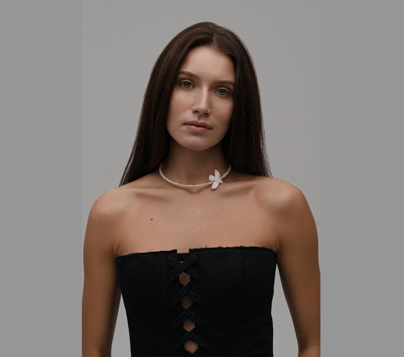 Necklace with big river pearls and a bird