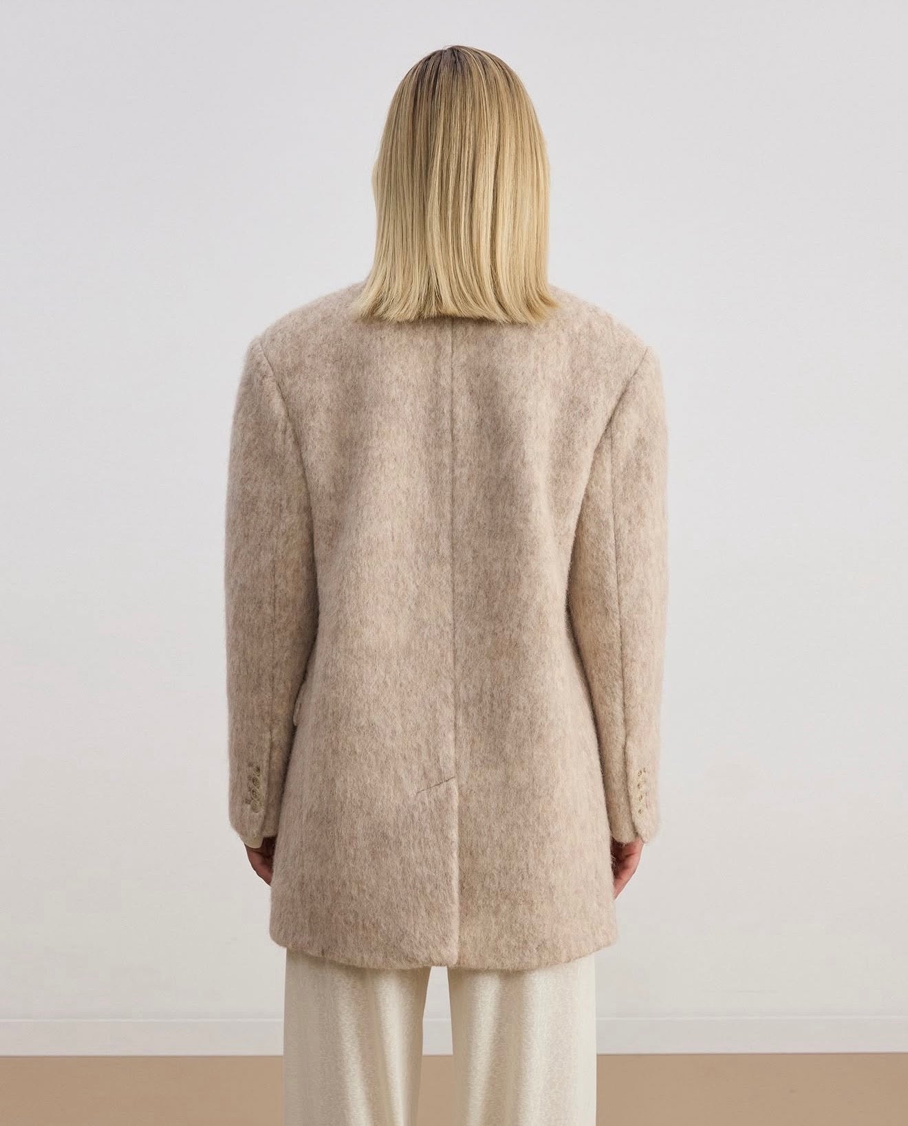 Double-breasted coat-jacket made of pile fabric