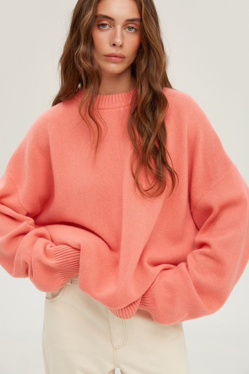 Warm sweater made of merino knit coral color