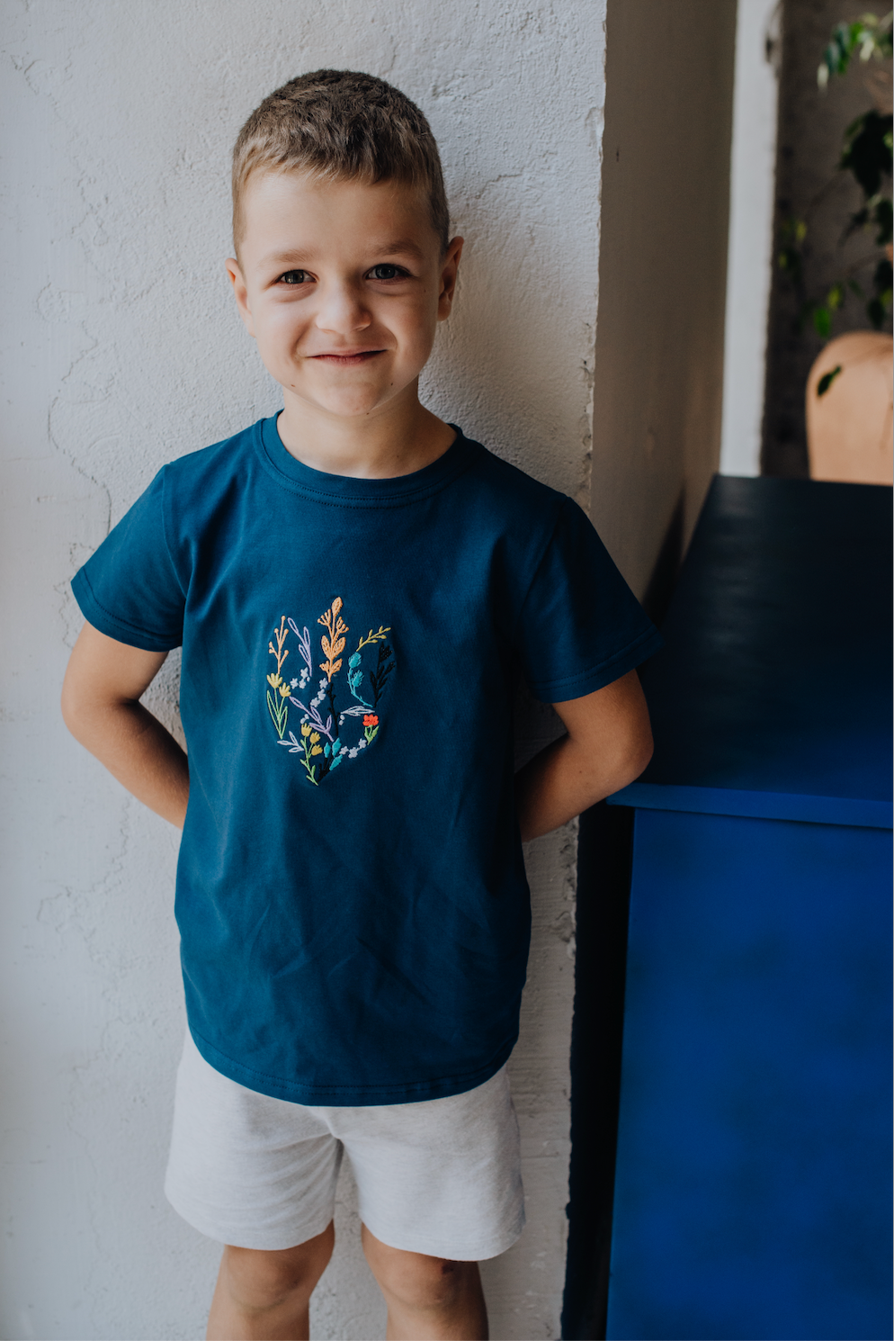 Universal T-Shirt for kids with Tryzub of flowers