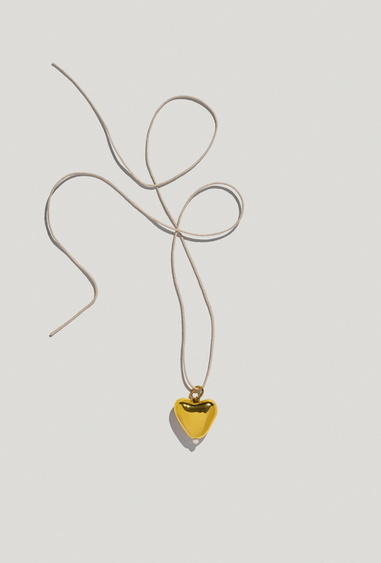 [S K A R B] big gold plated heart pendant on a cord