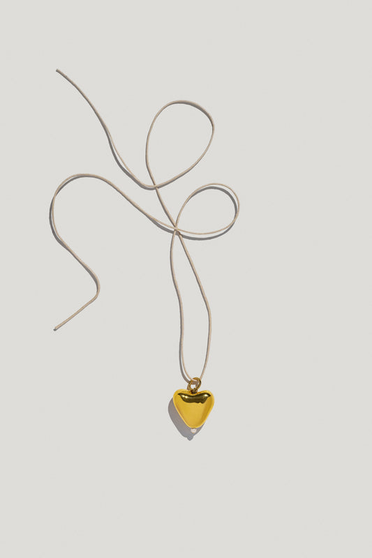 [S K A R B] small gold plated heart pendant on a cord