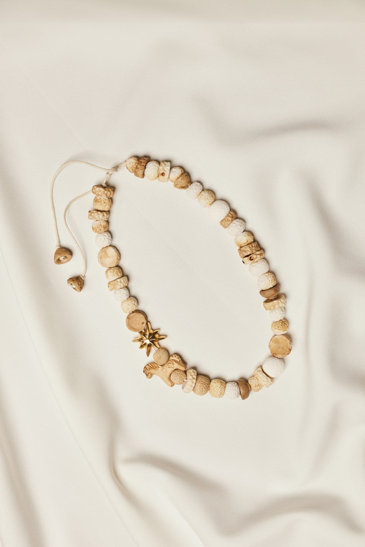 DREAM necklace made of ground beads with a gold star